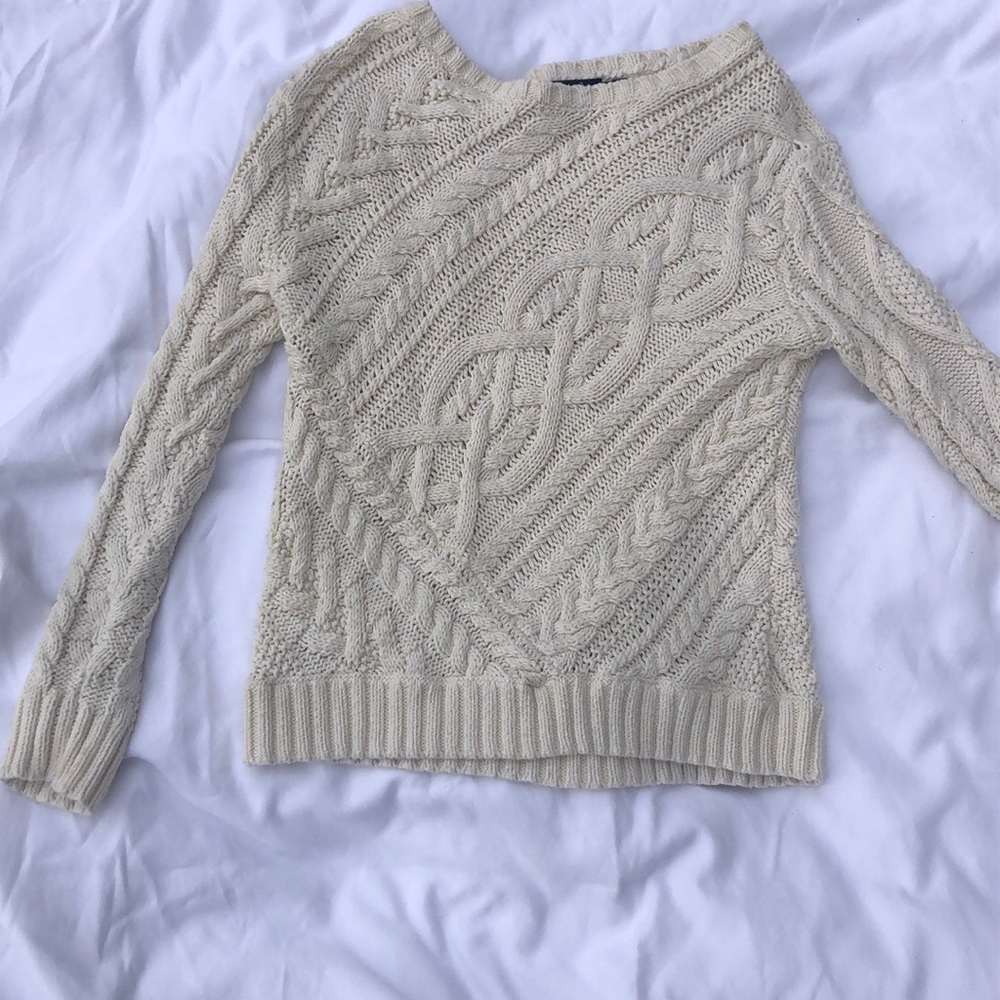 A beige Ralph Lauren cable knit sweater. Size M.